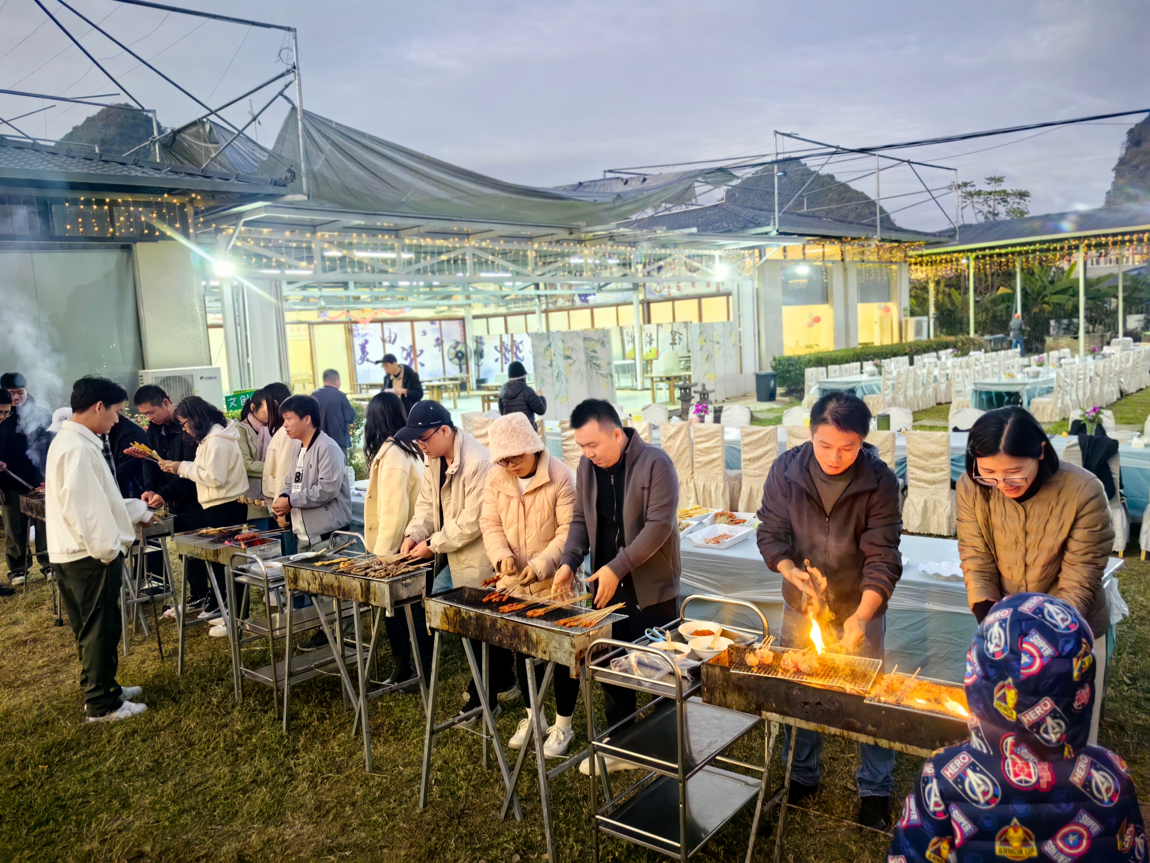 XY Global Service Team at Metal and Ceramic Injection Molding Having a Barbecue Outdoors
